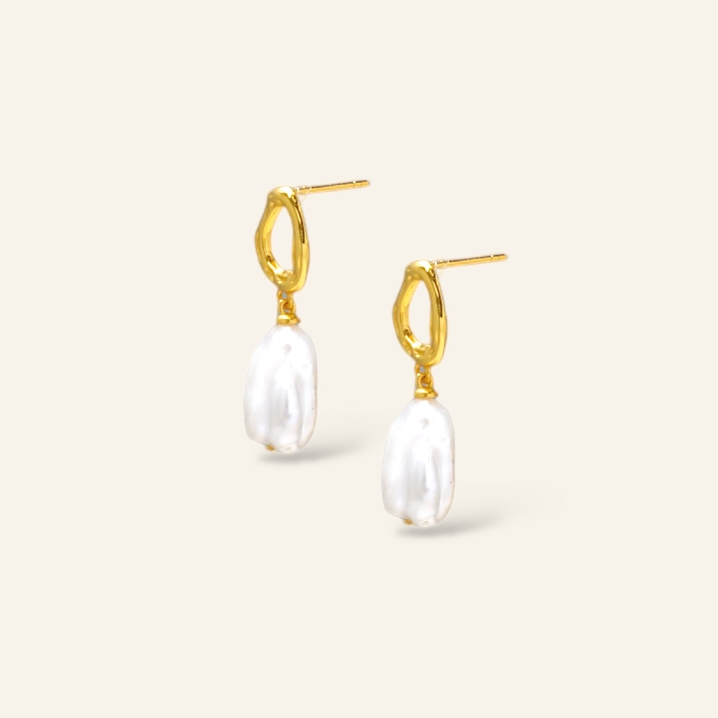 Gold hoop earrings with white pearls
