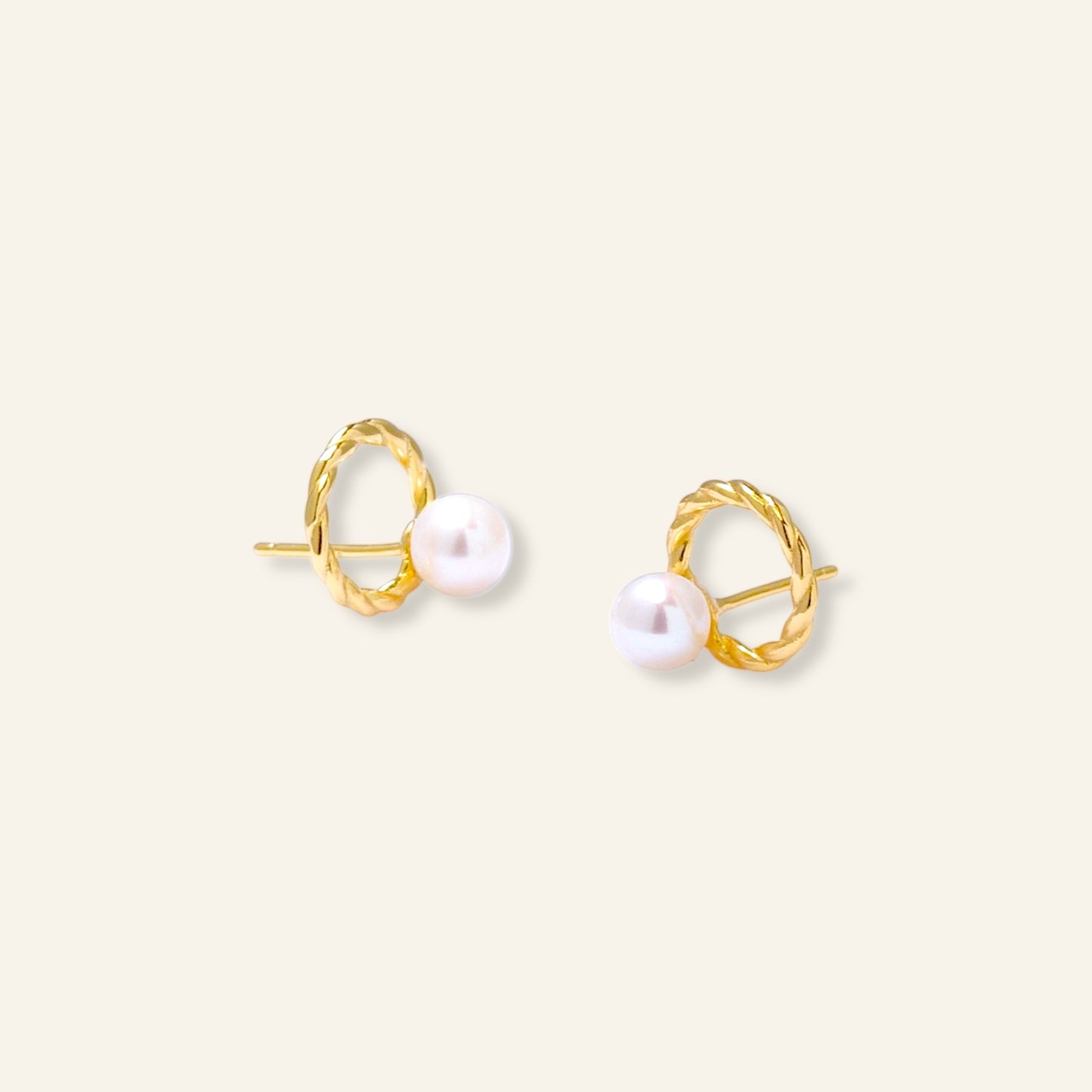Gold hoop earrings with white pearls