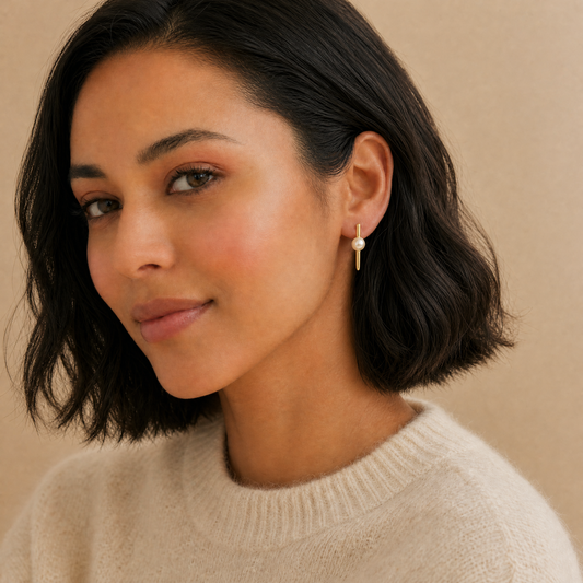 Woman wearing pearl earrings