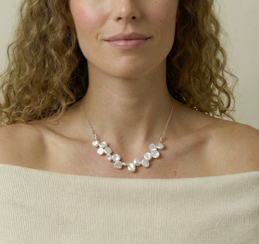 Woman wearing a pearl necklace