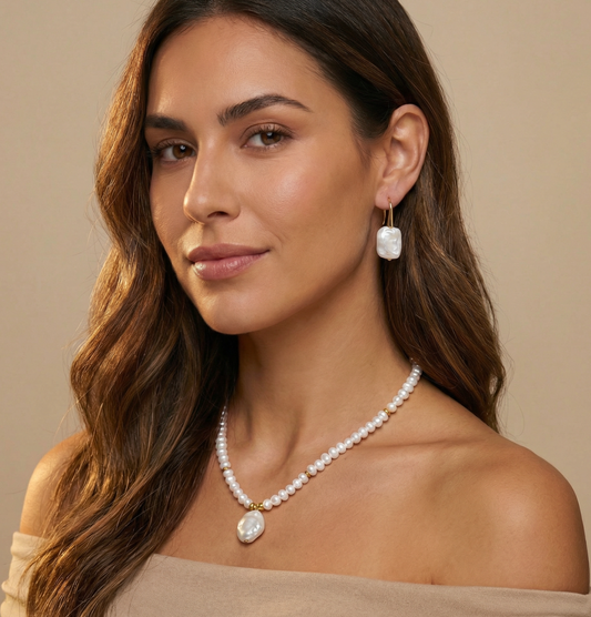 Woman wearing a pearl necklace and earrings