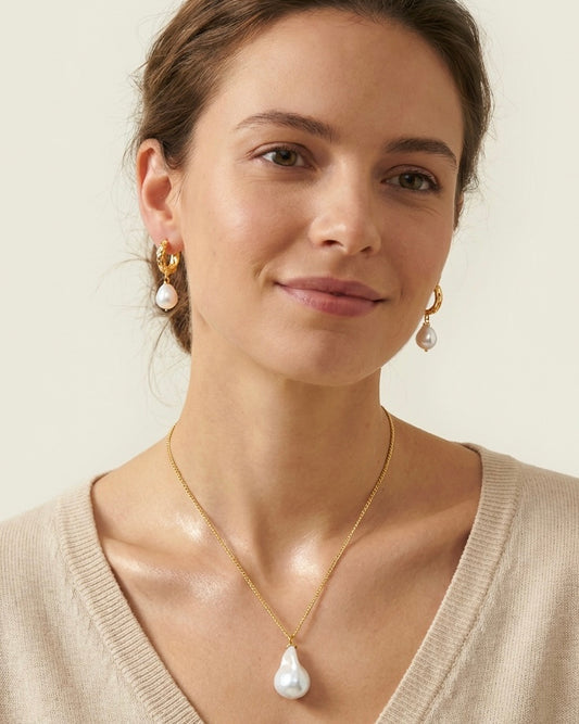 Woman wearing pearl earrings and a necklace