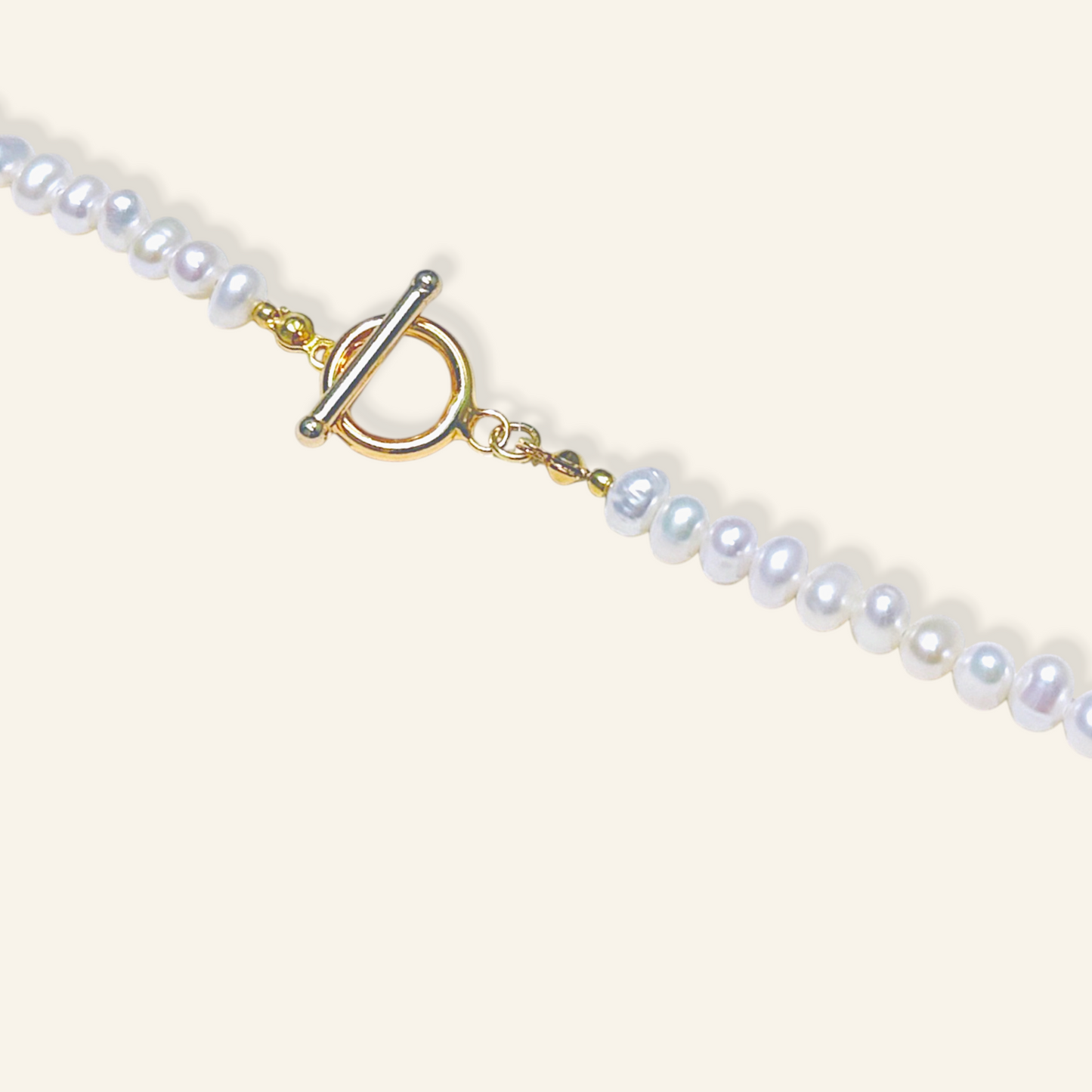 Pearl necklace with a gold clasp