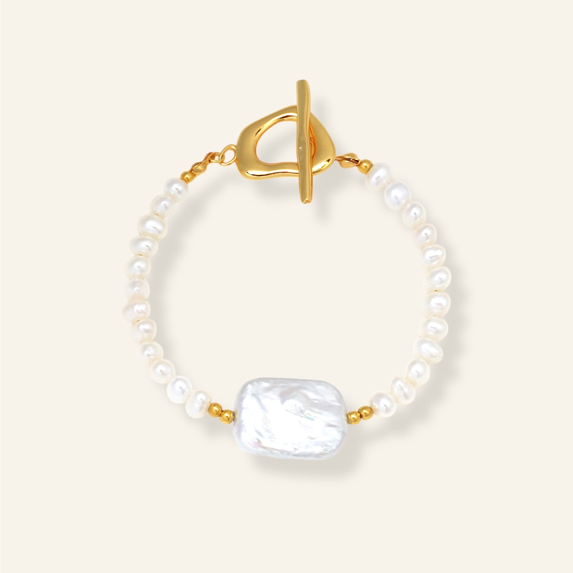 Pearl bracelet with a gold clasp on a white background