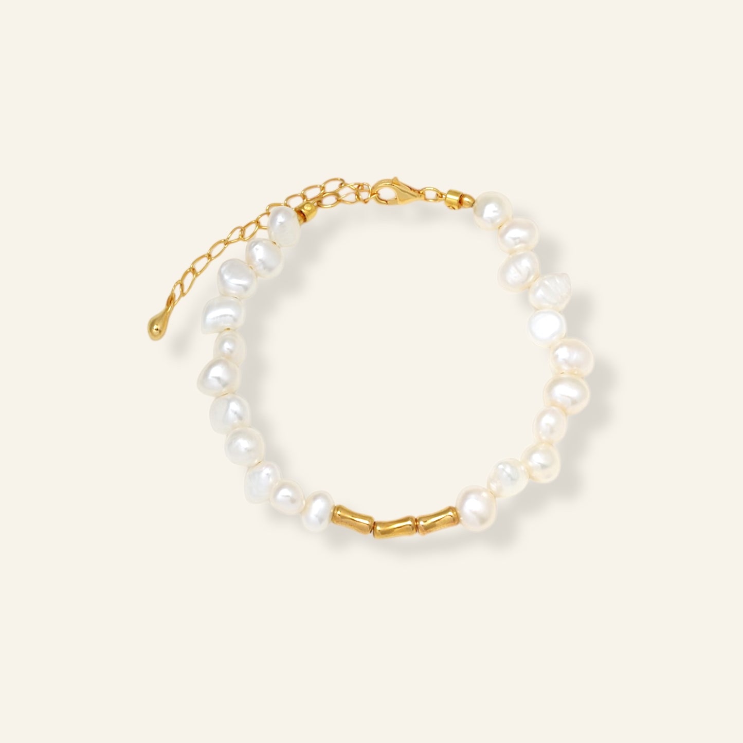 Pearl bracelet with gold chain on a white background