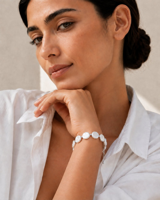 Model wearing the Luna freshwater coin pearl bracelet in silver