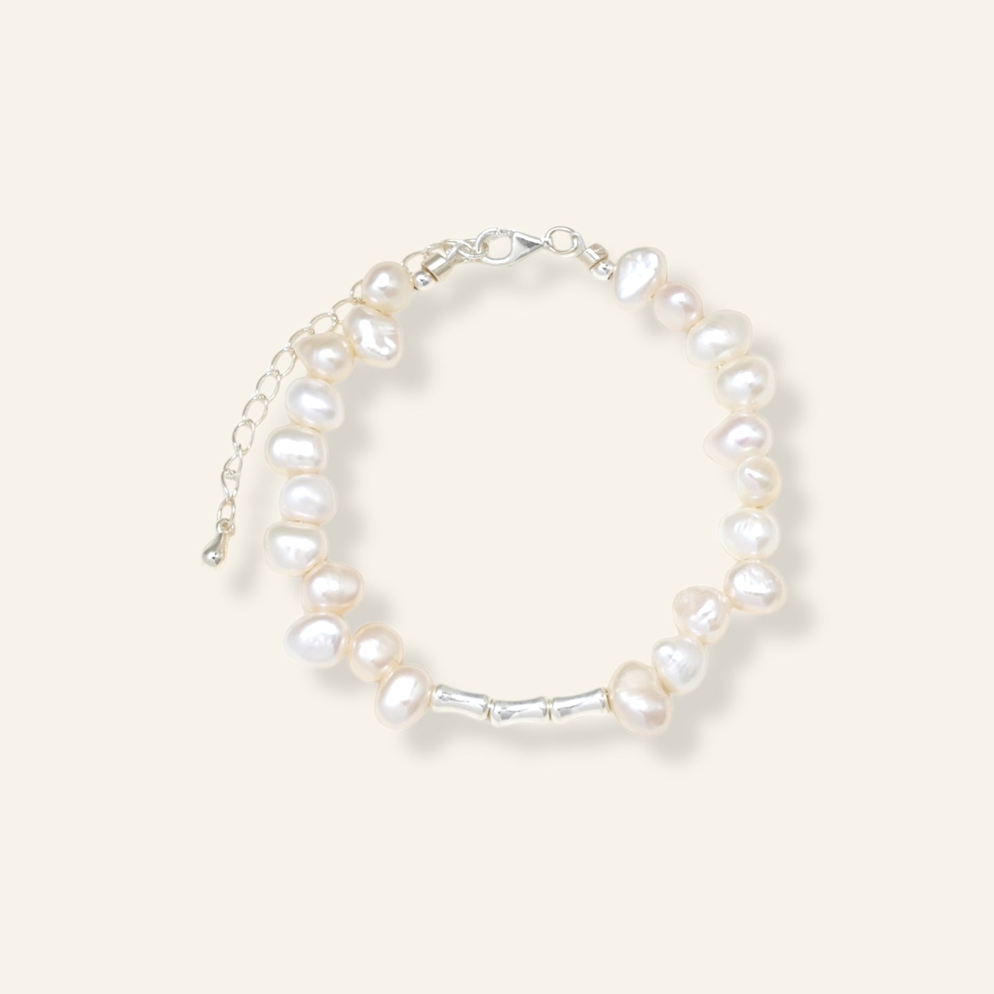 Pearl bracelet on a light gray background