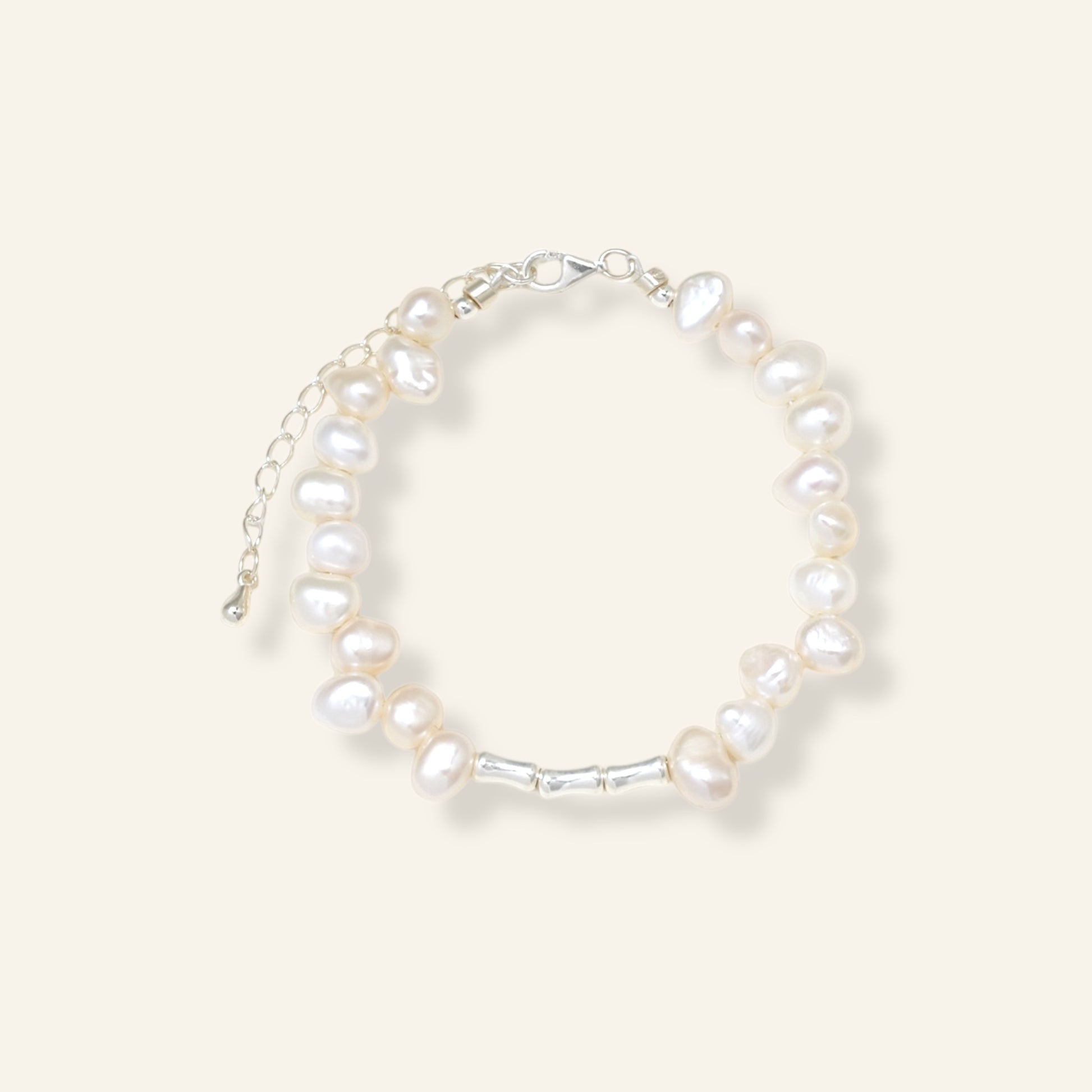 Pearl bracelet on a light gray background