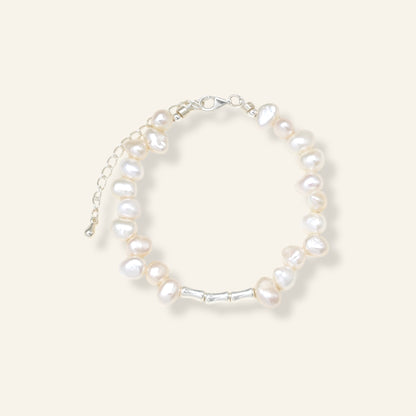 Pearl bracelet on a light gray background