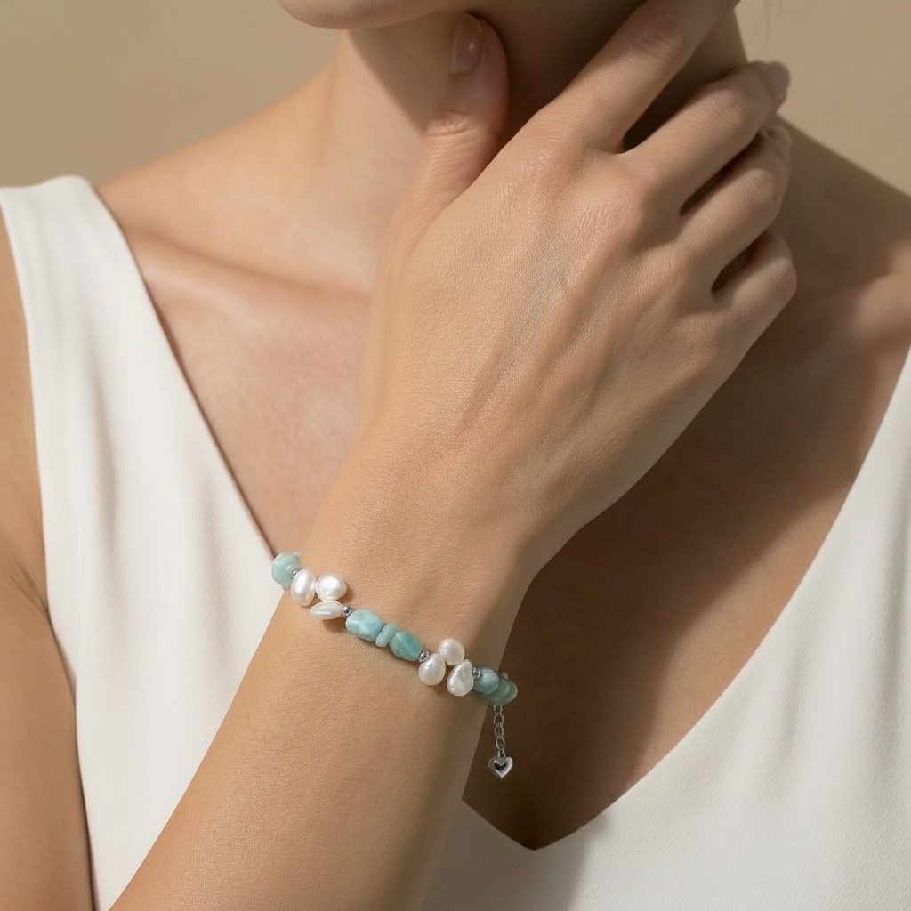 a woman wearing a pearl bracelet 