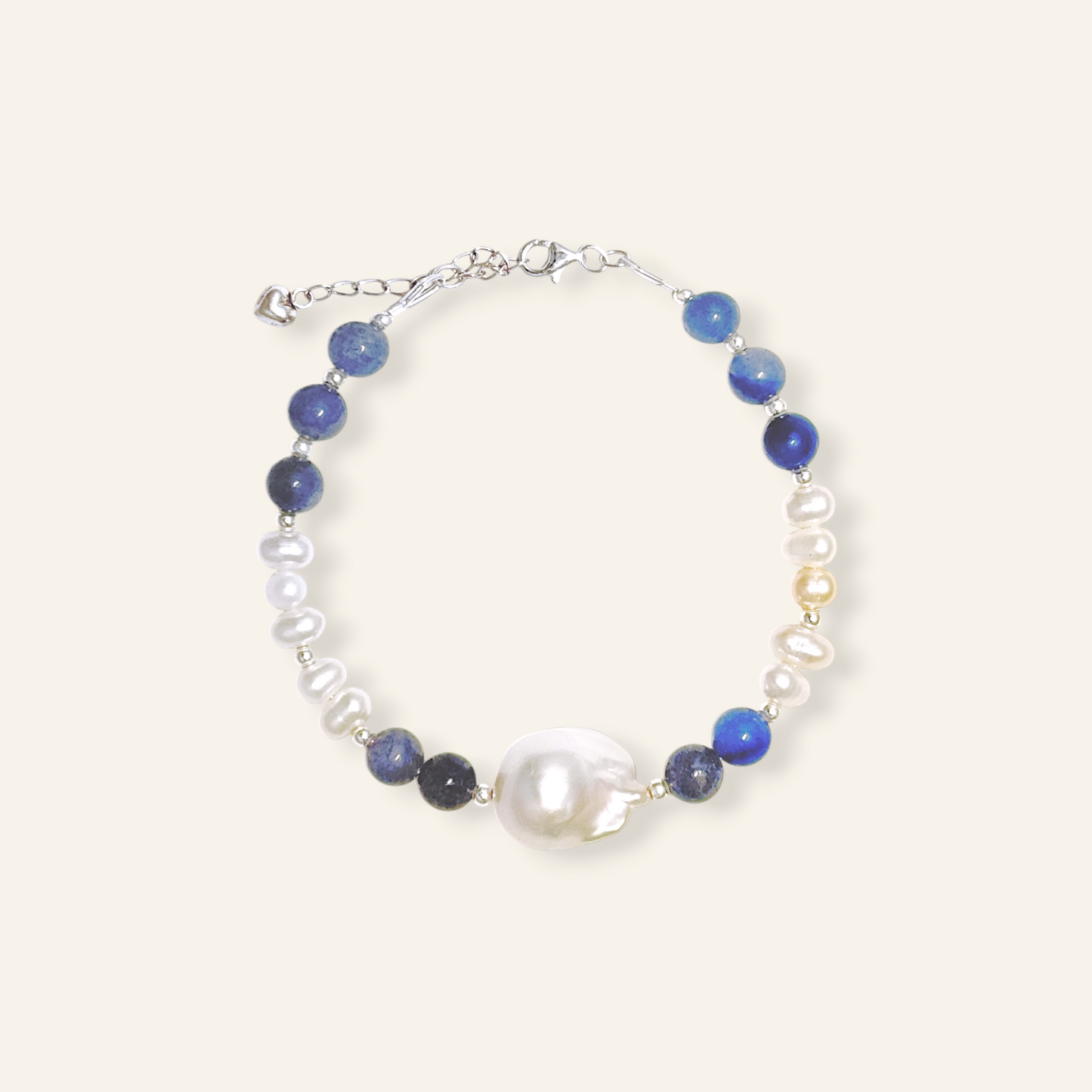 Baroque freshwater pearl bracelet with natural blue gemstones and sterling silver.