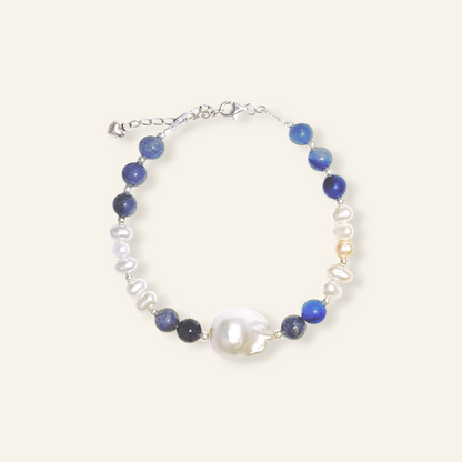 Baroque freshwater pearl bracelet with natural blue gemstones and sterling silver.