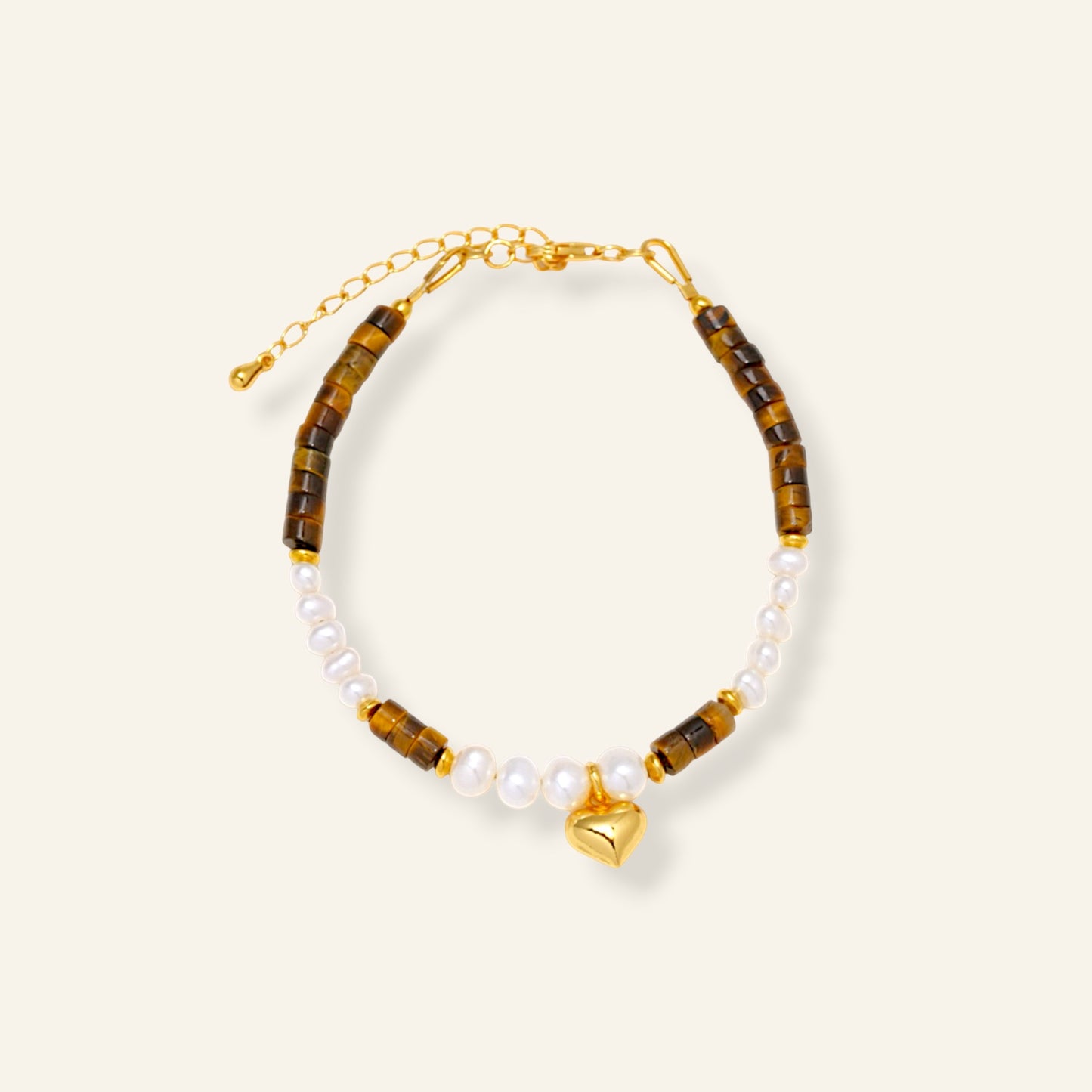 Bracelet with tiger eye beads, pearls, and a gold heart charm 