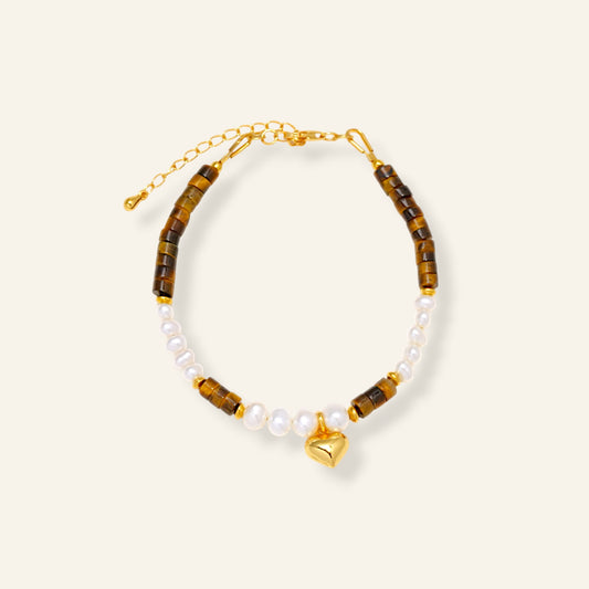 Bracelet with tiger eye beads, pearls, and a gold heart charm 