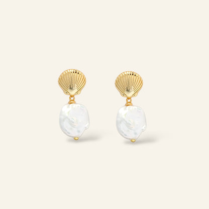 Pair of pearl earrings with gold shell-like tops in Australia