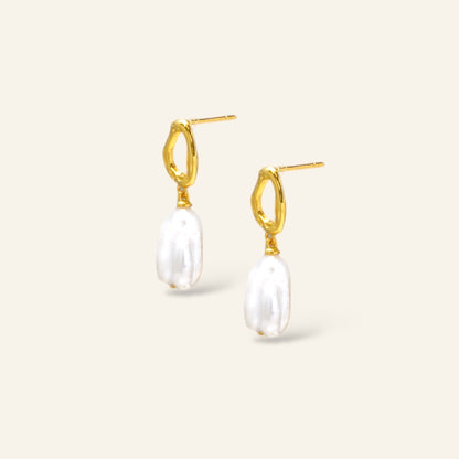 Gold hoop earrings with white pearls 
