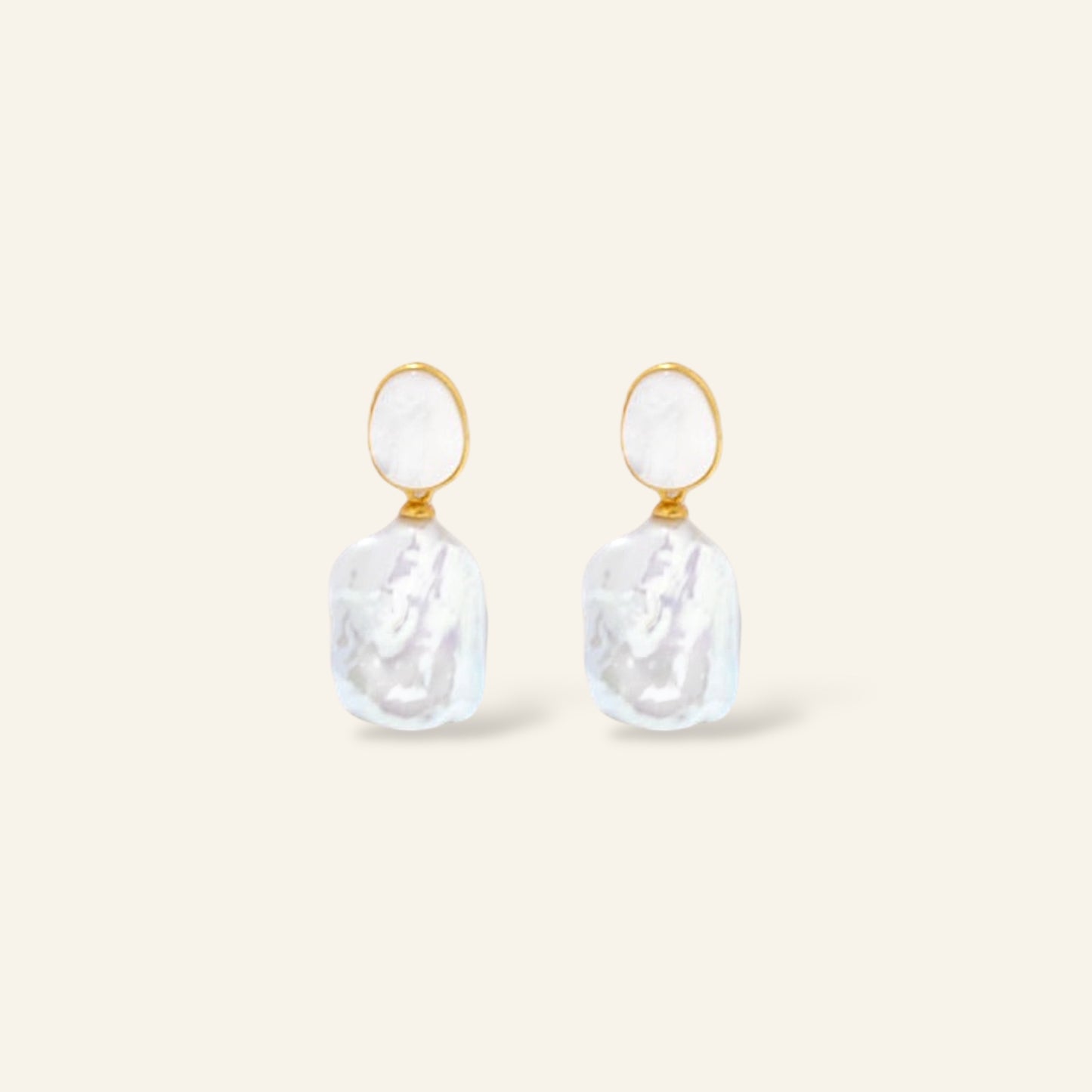 Pair of pearl earrings with gold accents 