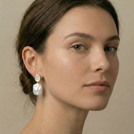 Close-up of a woman wearing elegant pearl earrings 