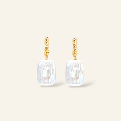 Pair of gold earrings with rectangular white pearl