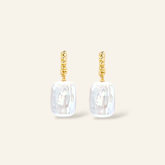 Pair of gold earrings with rectangular white pearl