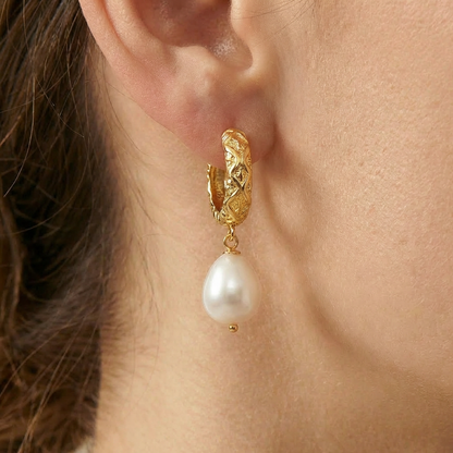 Gold earring with a pearl drop 
