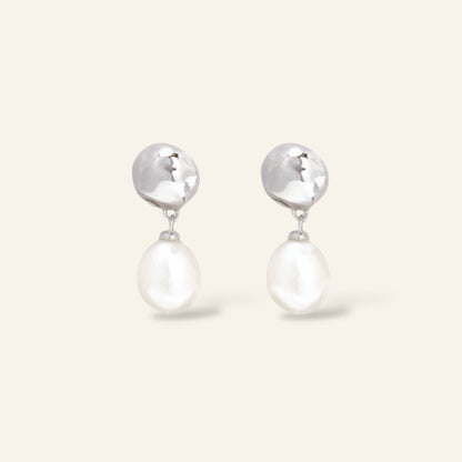 Pair of silver earrings with pearl drops