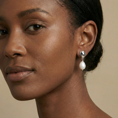 Close-up of a woman wearing pearl earrings 