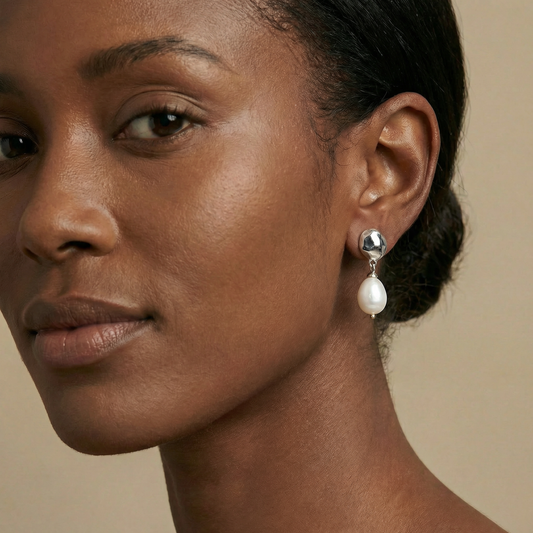 Close-up of a woman wearing pearl earrings 