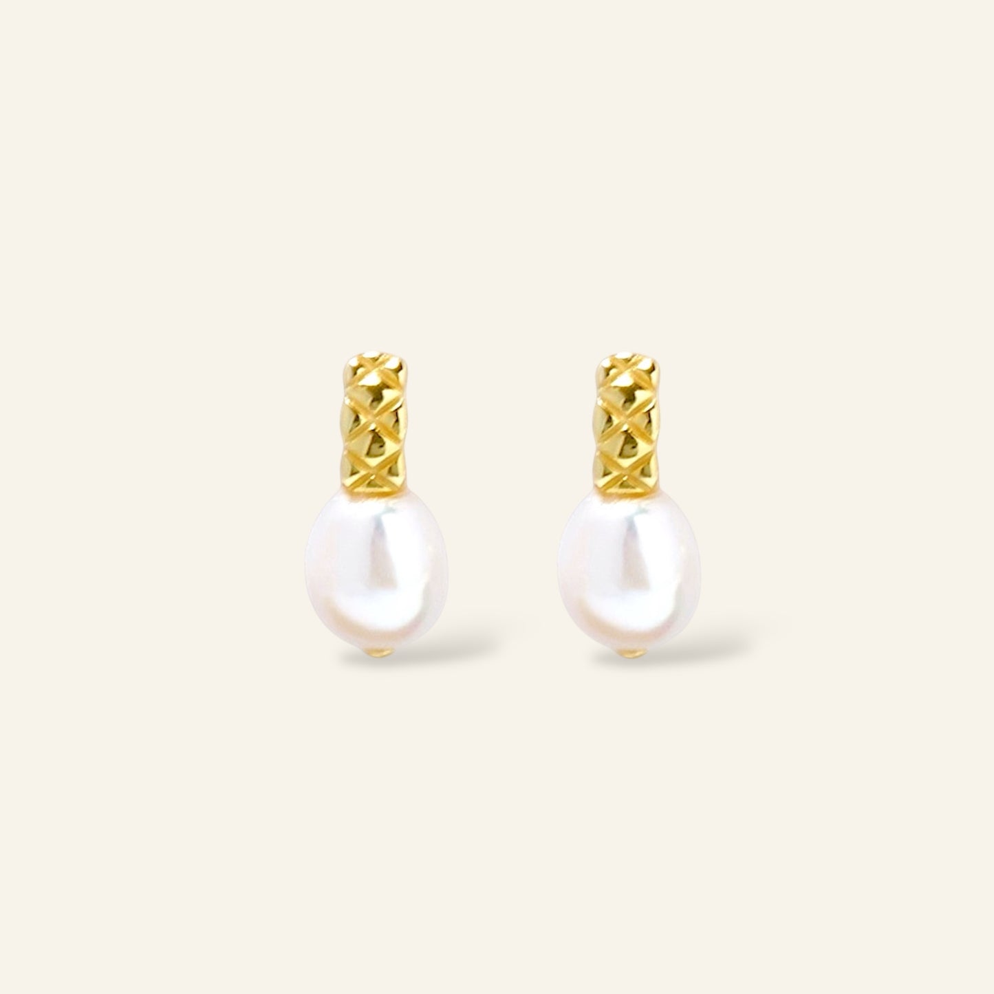 Pair of pearl earrings with gold accents
