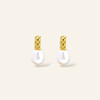 Pair of pearl earrings with gold accents