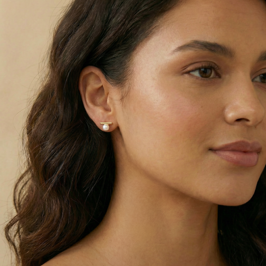 Close-up of a woman wearing a pearl earring 
