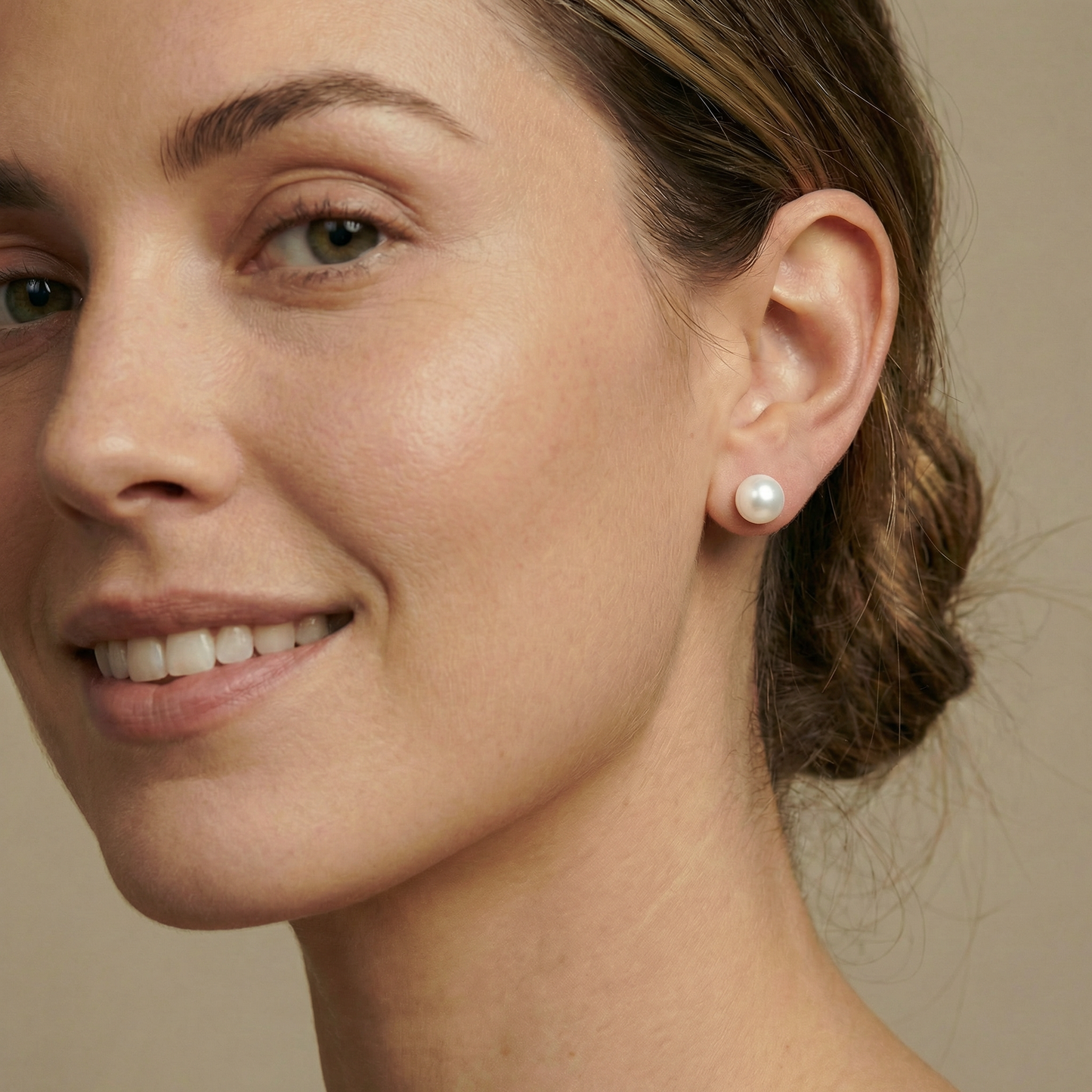 Close-up of a woman wearing pearl earrings 