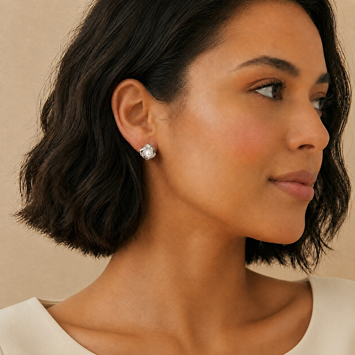 Model wearing Pearl Bloom freshwater pearl stud earrings in silver