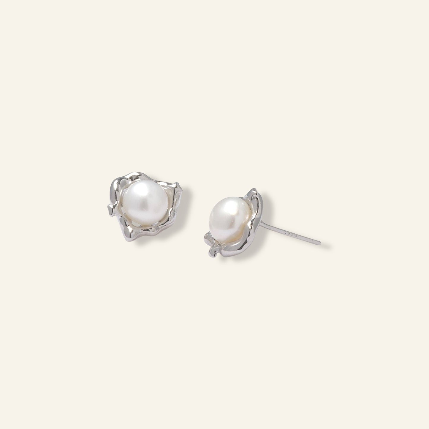 Pair of pearl earrings with silver settings 