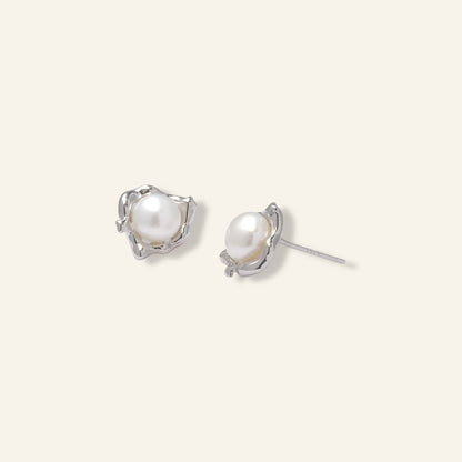 Pair of pearl earrings with silver settings 