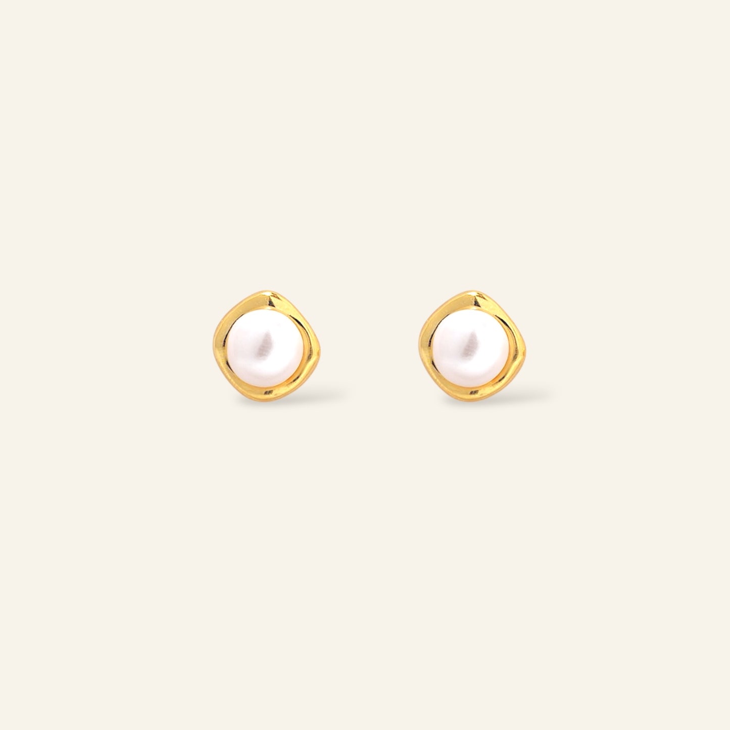 Gold hoop earrings with pearl centers 