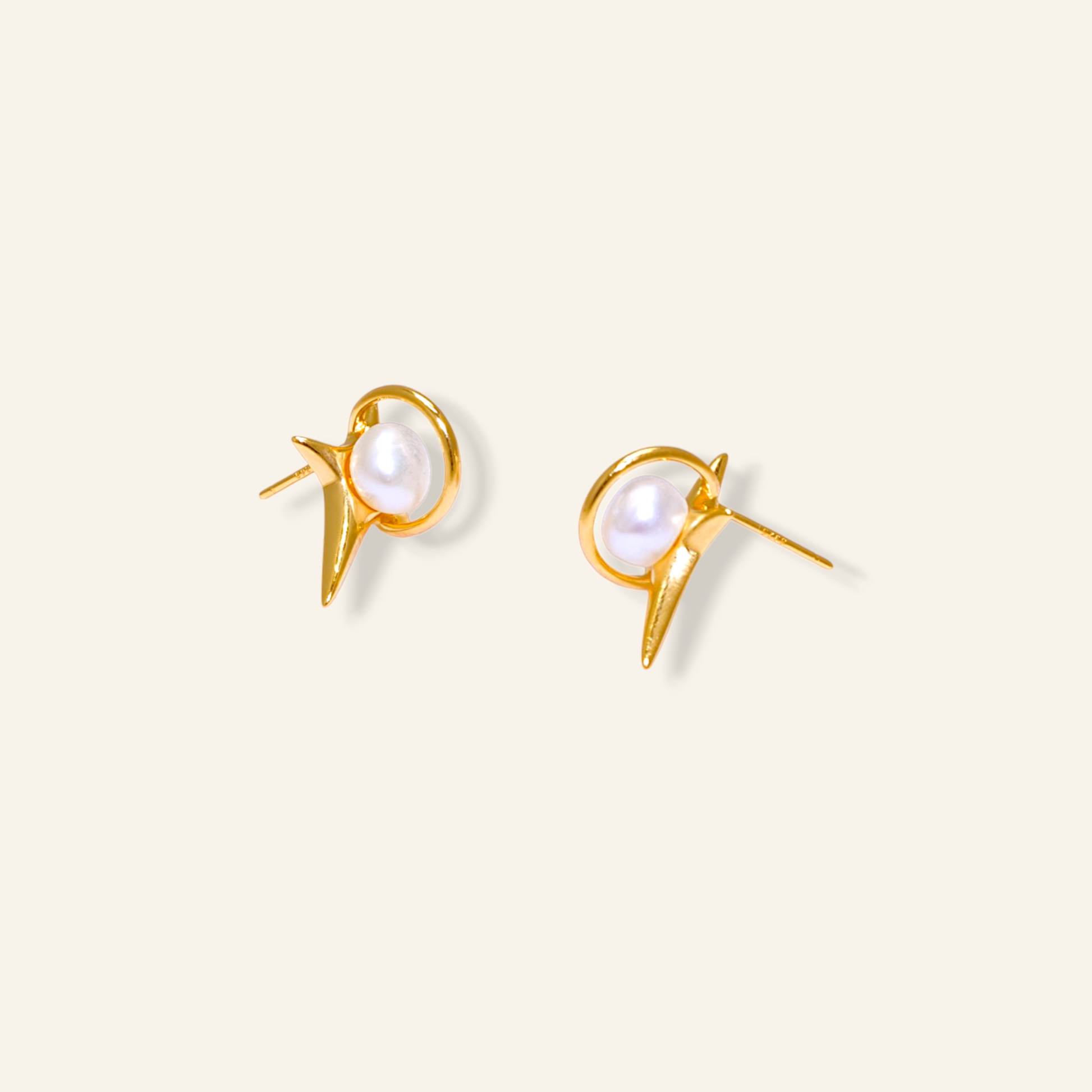 Gold earrings with pearl centers 