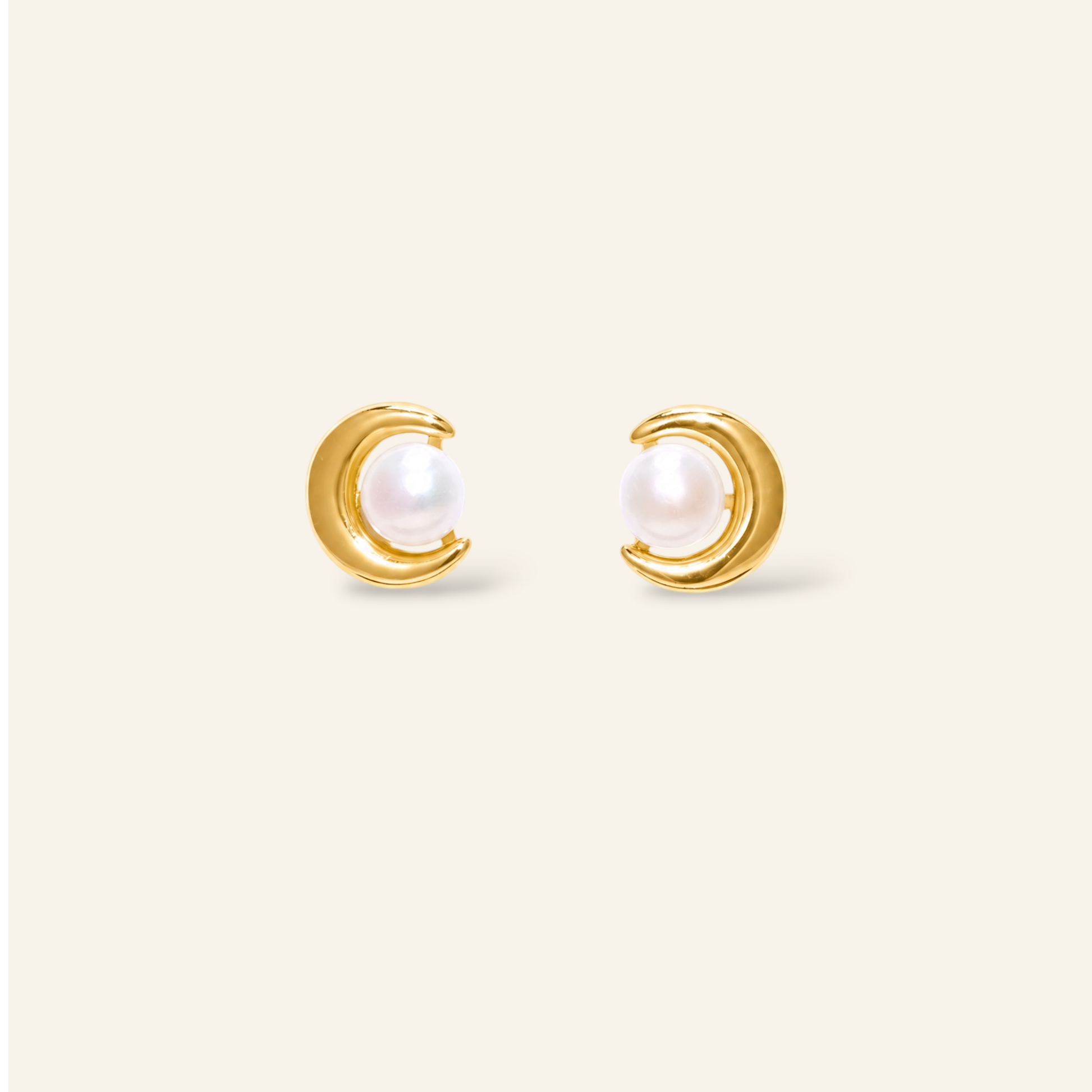 Gold earrings with pearl centers 