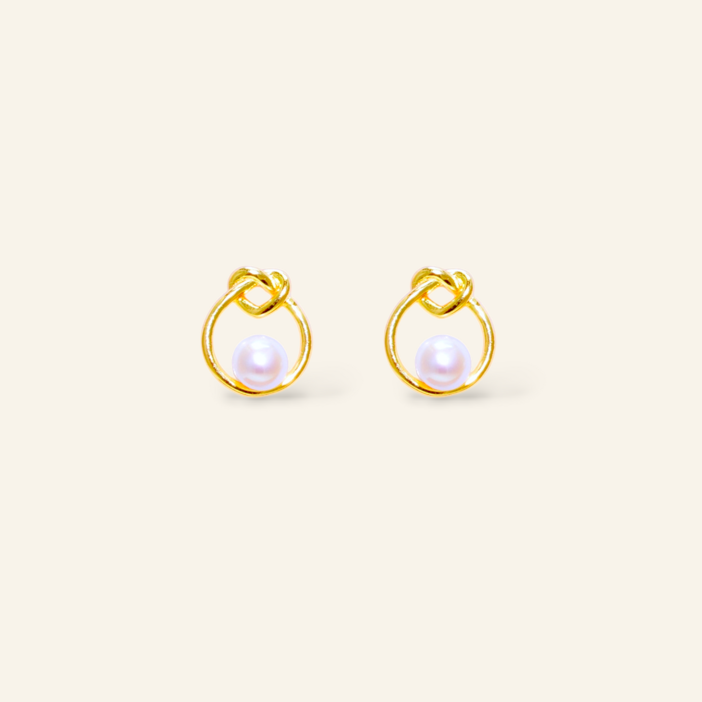 Pair of gold earrings with pearl centers 