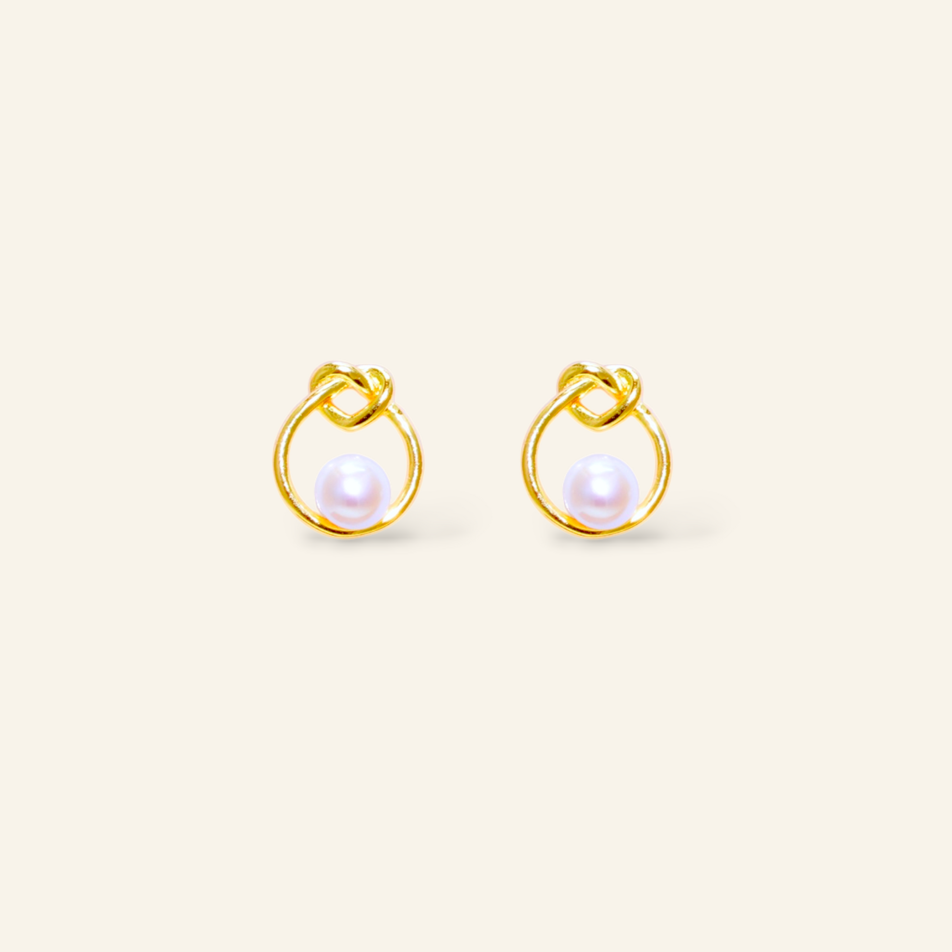 Pair of gold earrings with pearl centers 