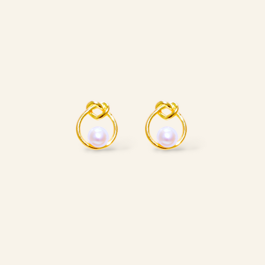 Pair of gold earrings with pearl centers 