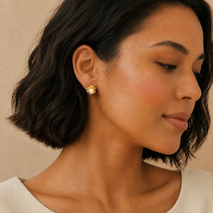 Model wearing Pearl Bloom freshwater pearl stud earrings in gold