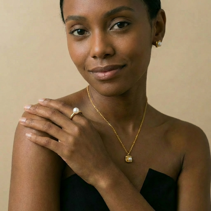 Woman wearing gold pearl jewelry 