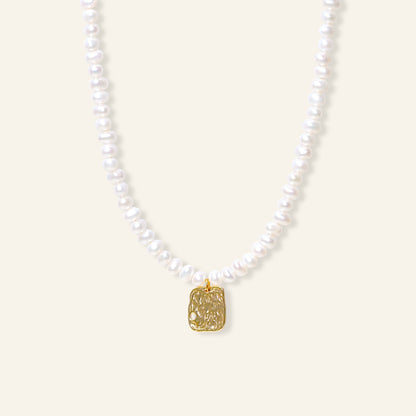 Pearl necklace with a gold pendant