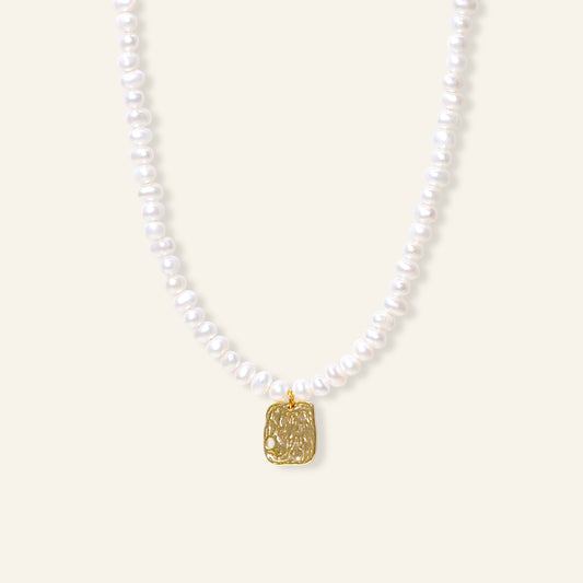 Pearl necklace with a gold pendant