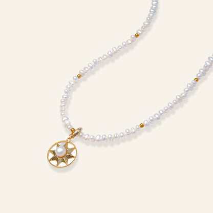 Pearl necklace with a gold pendan