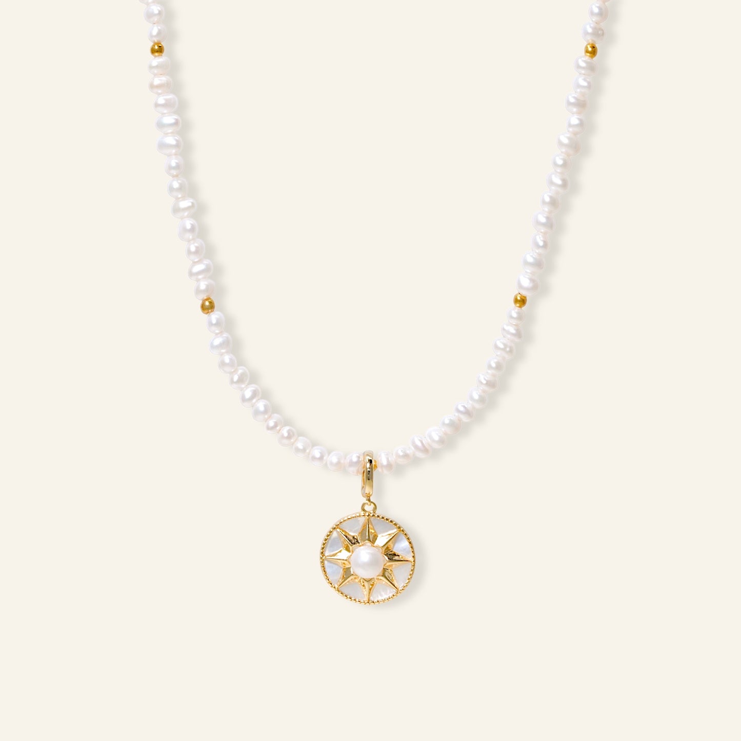 Pearl necklace with a gold pendant