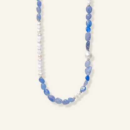 A necklace featuring light blue stone beads, white freshwater pearls